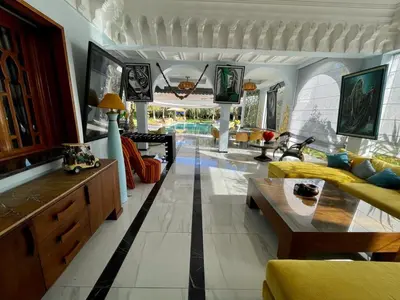 a living room with a couch and a table at Villa Souzana in Marrakech