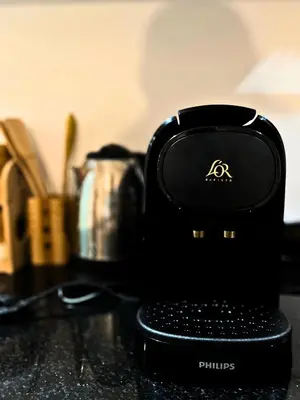 a black blender sitting on top of a counter at Le Cosy de Gueliz avec Piscine et Belle Vue in Marrakech