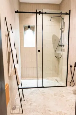 a shower with a glass door in a bathroom at Prestigia Golf Saphire in Marrakech