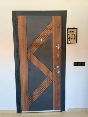 a glass door with a wooden frame on a wall at charming apartment close to airport Marrakech in Marrakech
