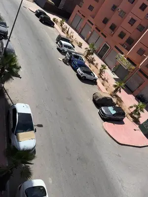 an aerial view of a street with parked cars at charming apartment close to airport Marrakech in Marrakech