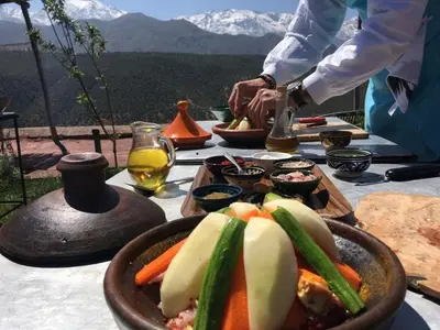 a table with a bowl of food on a table at Spacious and Family Apartment in Marrakech