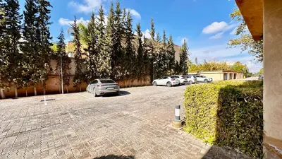 a group of cars parked in a parking lot at Cozy appartement Marrakech in Marrakech