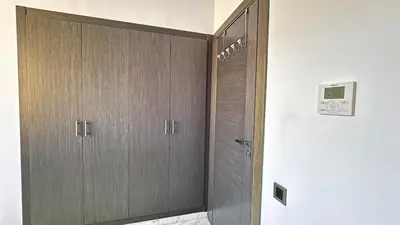 a room with two wooden lockers in a room at Cozy appartement Marrakech in Marrakech