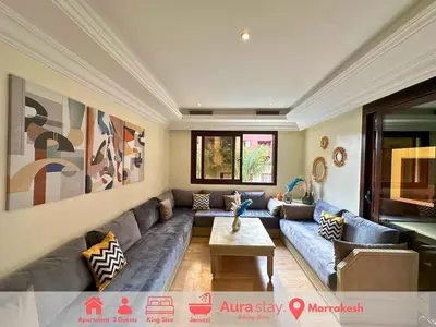 a living room with a couch and a table at Exclusive Luxury Stay with Pool, Jacuzzi and Service in Marrakech