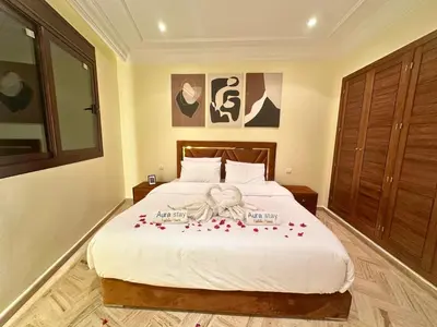 a bedroom with a bed with red roses on it at Exclusive Luxury Stay with Pool, Jacuzzi and Service in Marrakech