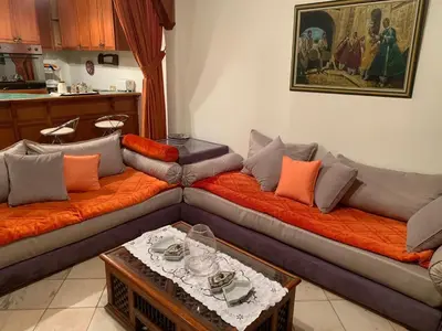 a living room with two couches and a table at SEJOUR D'EXCEPTION LUXE Et SERENITE MARRAKECH in Marrakech