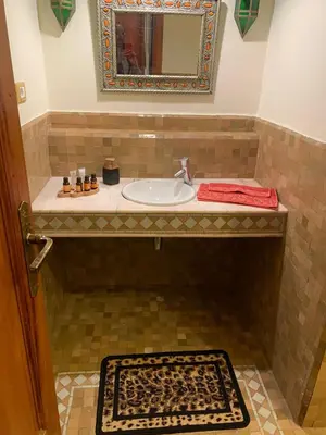 a bathroom with a sink and a mirror at SEJOUR D'EXCEPTION LUXE Et SERENITE MARRAKECH in Marrakech
