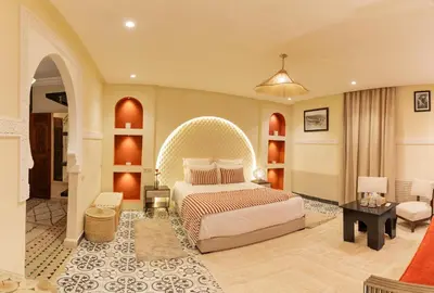a bedroom with a bed with an arched ceiling at Riad Dar Lamia Marrakech Médina in Marrakech