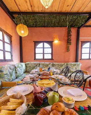 a table with food on it in a living room at Riad Dar Lamia Marrakech Médina in Marrakech