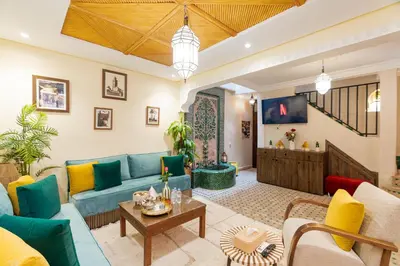 a living room with a couch and a table at Riad Dar Lamia Marrakech Médina in Marrakech