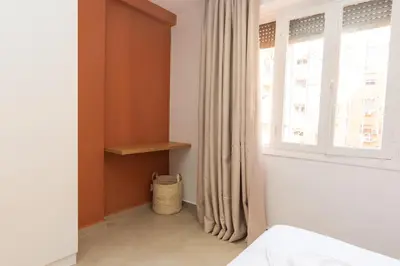 a bedroom with a bed and a window at Cozy suite Comfort et elegance in Marrakech