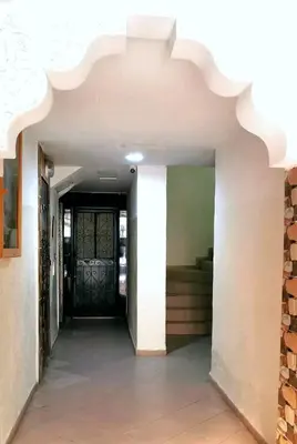 an empty hallway with a door in a building at Do7a Marrakech in Marrakech