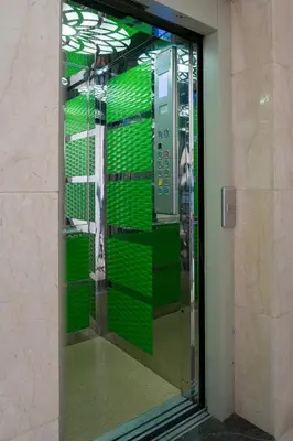 a display case with green shelves in a building at حي الشرف in Marrakech