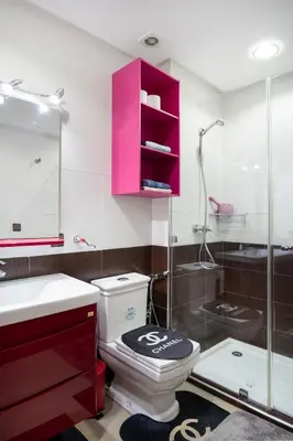 a bathroom with a toilet and a pink cabinet at حي الشرف in Marrakech
