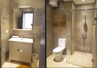 two pictures of a bathroom with a toilet and a shower at Skyline Studios Hivernage in Marrakech