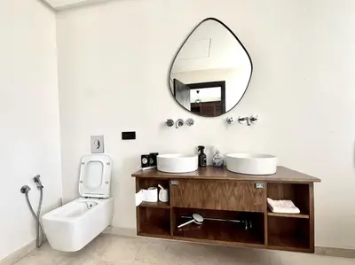 a bathroom with two sinks and a mirror at villa éden marrakech in Oulad Ikhia