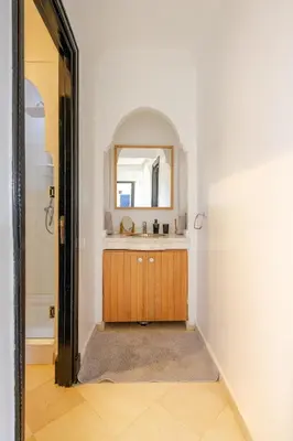 a bathroom with a sink and a mirror at Marrakech River Palm in Dar Caïd Layadi