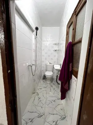 a bathroom with a toilet and a sink at Suite 1 in Marrakech