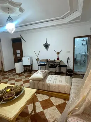 a living room with a couch and a table at Suite 1 in Marrakech
