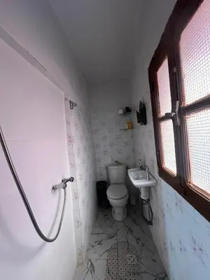 a bathroom with a toilet and a sink at Suite 1 in Marrakech