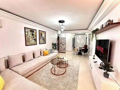 a living room with a couch and a table at Marrakech in Marrakech