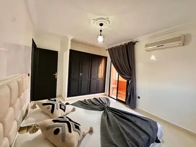 a bedroom with two pillows on the floor and a window at Marrakech in Marrakech
