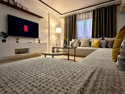a living room with a couch and a tv at Marrakech in Marrakech