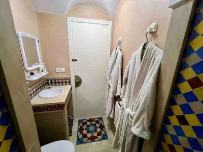 a bathroom with a sink and a toilet and a shower at Modern Studio with Pool in Central Gueliz in Marrakech