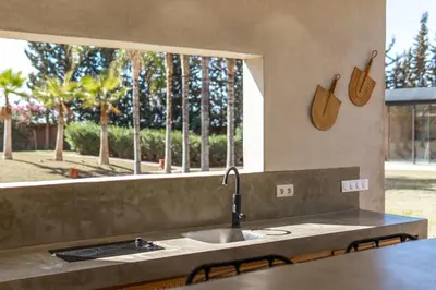 a kitchen counter with a sink and a window at Villa Anna - Havre de paix in Oulad Ikhia
