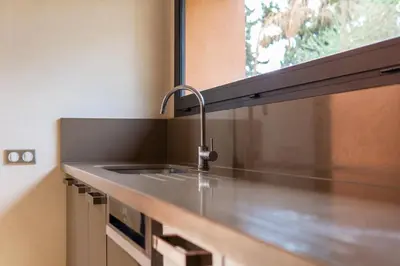 a kitchen counter with a sink and a window at Villa Anna - Havre de paix in Oulad Ikhia