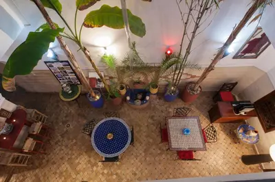 an overhead view of a living room with potted plants at Riad Thycas in Marrakech