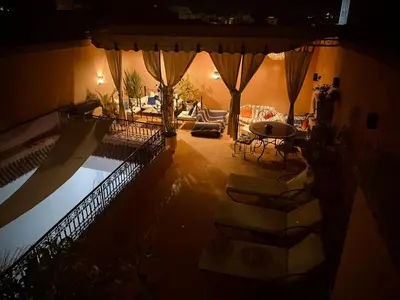 a view of a living room with a swimming pool at Riad Thycas in Marrakech