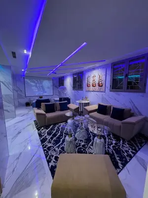 a large living room with couches and a table at Beautiful new modern house with full comfort in Marrakech