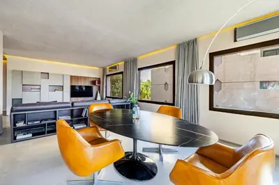 a dining room with a table and chairs at Luxury 1 BDR Hivernage in Marrakech