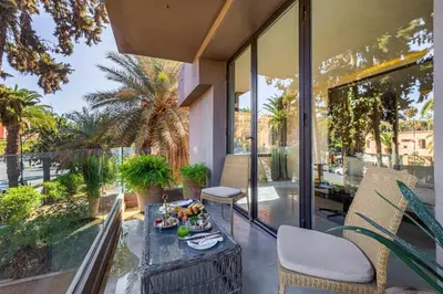 a balcony with a table with food on it at Luxury 1 BDR Hivernage in Marrakech