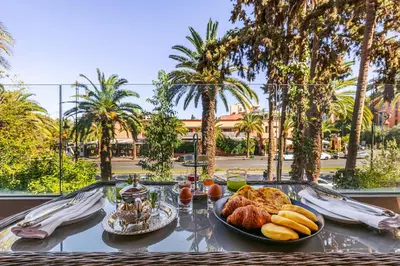 a table with a tray of breakfast food on it at Luxury 1 BDR Hivernage in Marrakech