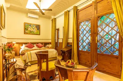 a bedroom with a bed and a window at Riad Habouba in Marrakech