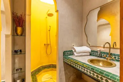 a bathroom with a sink and a mirror at Riad Habouba in Marrakech