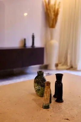 three vases sitting on top of a table at Luxueux DUPLEX au cœur Marrakech in Marrakech