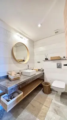 a bathroom with a sink and a mirror at Luxueux DUPLEX au cœur Marrakech in Marrakech