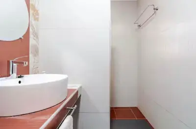 a bathroom with a white sink and a mirror at Golden Palm 2 in Marrakech