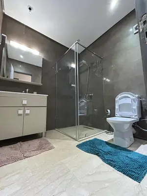 a bathroom with a shower and a toilet and a sink at Atrani1 happy holiday in Marrakech