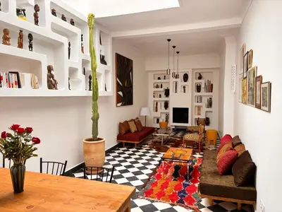 a living room with a couch and a table at Dar Nook in Marrakech