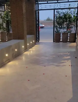 an empty patio with lights and plants in a building at Magnifique appartement sur Marrakech in Marrakech