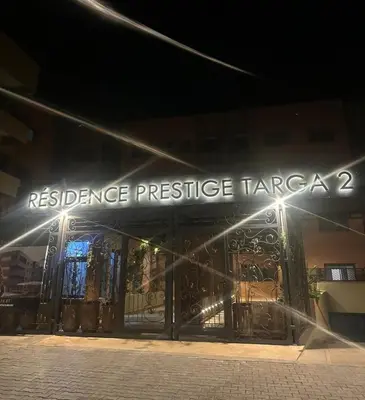 a building with a sign that reads resistance pressure taza at Magnifique appartement sur Marrakech in Marrakech