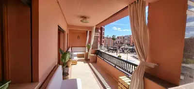 an apartment balcony with a view of a street at La Plaza cœur de Gueliz in Marrakech