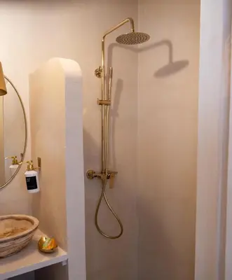 a shower stall in a bathroom with a sink at Riad Dar Sary Marrakech médina privé 3 chambres in Marrakech