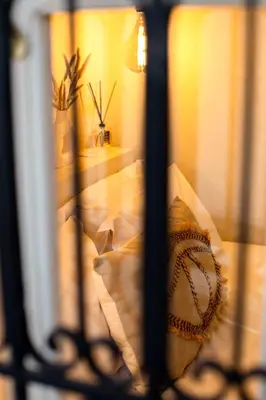 a view through a barred window with a basketball at Riad Dar Sary Marrakech médina privé 3 chambres in Marrakech
