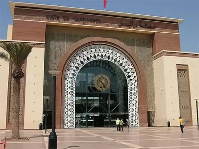 a large building with a clock on the front of it at Appartement ZAHRA HOME in Marrakech